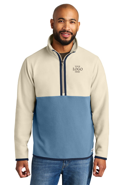 Man wearing a two-tone pullover with a visible logo on a white background Cotopaxi® Amado 1/2-Zip Fleece, Embroidered