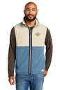Man wearing a two-tone jacket with customizable logo area on a white background, Embroidered Cotopaxi® Amado Fleece Vest
