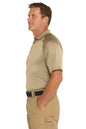 Man wearing a beige polo shirt and pants on a white background. Embroidered CornerStone® Select Snag-Proof Tactical Polo