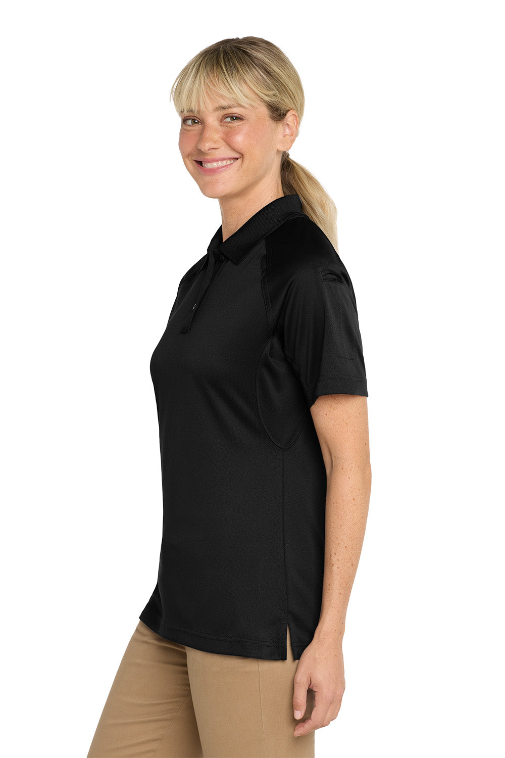 Woman wearing a black polo shirt on a white background, CornerStone® Women's Select Snag-Proof Tactical Polo