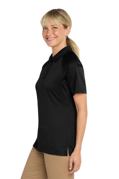 Woman wearing a black polo shirt on a white background, CornerStone® Women's Select Snag-Proof Tactical Polo