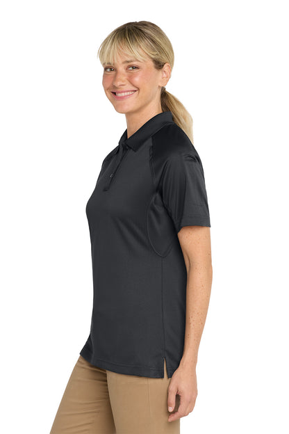 Woman wearing a black short-sleeve shirt on a white background, CornerStone® Women's Select Snag-Proof Tactical Polo