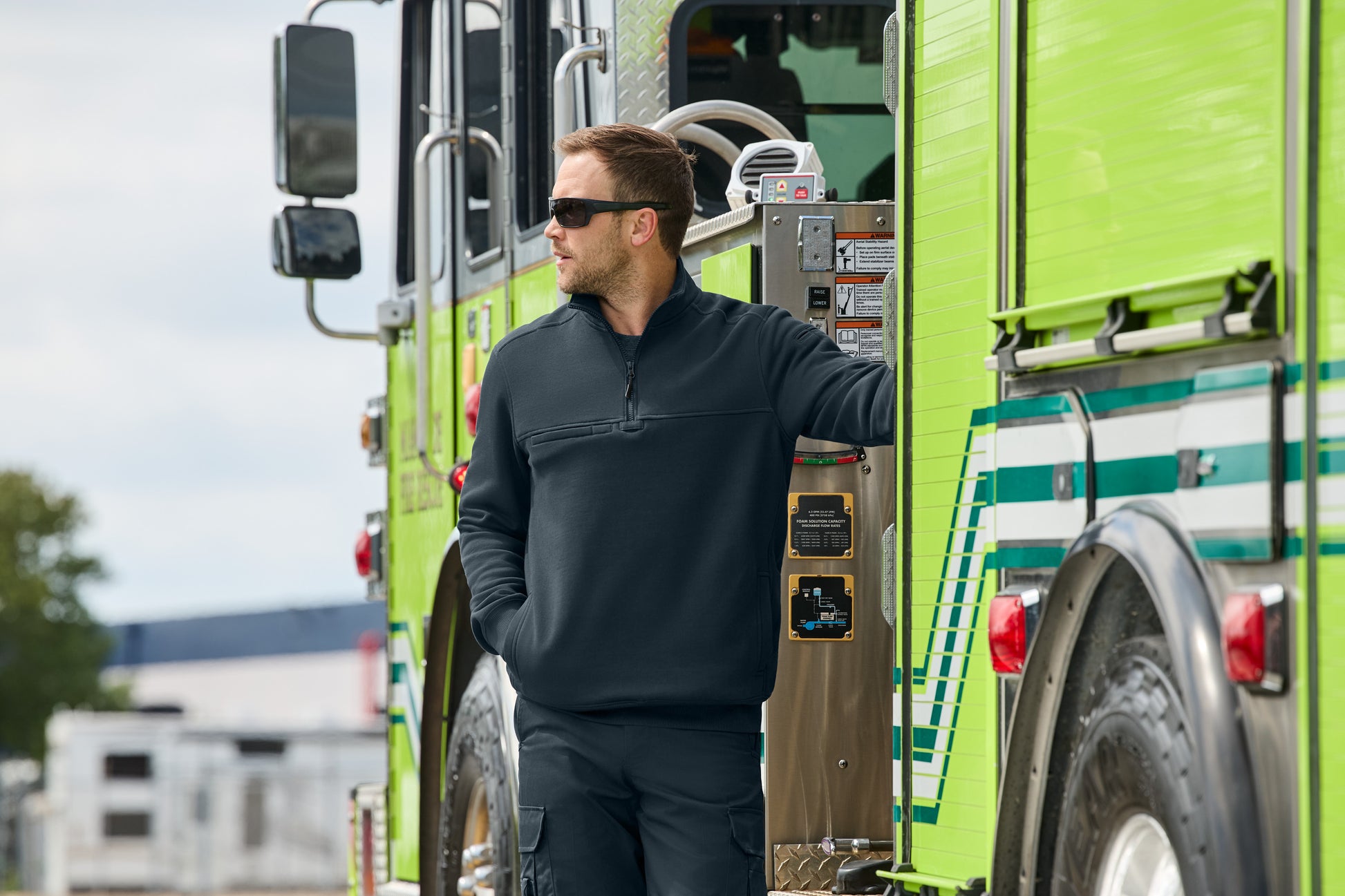 Man standing next to a green fire truck, CornerStone® 12-Oz. Tough Fleece Job Shirt, Embroidered