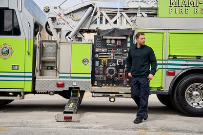 Man standing next to a green fire truck with visible equipment CornerStone® 12-Oz. Tough Fleece Job Shirt, Embroidered