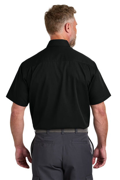 Man wearing a black short-sleeve shirt and gray pants on a white background emroidered CornerStone® Short Sleeve Select Ripstop Shirt