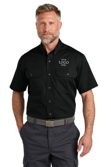 Man wearing a black short-sleeve work shirt with customizable logo area on a white background emroidered CornerStone® Short Sleeve Select Ripstop Shirt