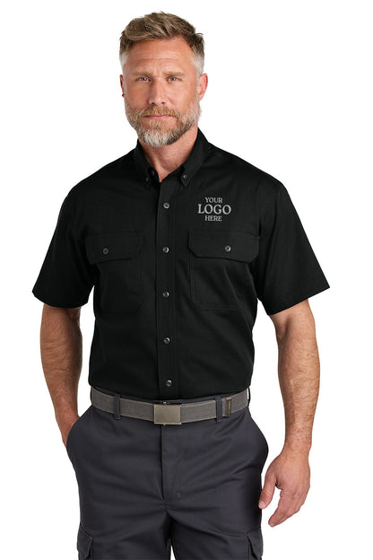 Man wearing a black short-sleeve work shirt with customizable logo area on a white background emroidered CornerStone® Short Sleeve Select Ripstop Shirt