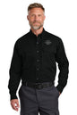 Man wearing a black shirt with a logo on a white background embroidered CornerStone® Long Sleeve Select Tactical Shirt