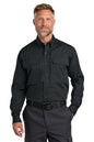 Man wearing a black shirt and pants on a white background embroidered CornerStone® Long Sleeve Select Tactical Shirt