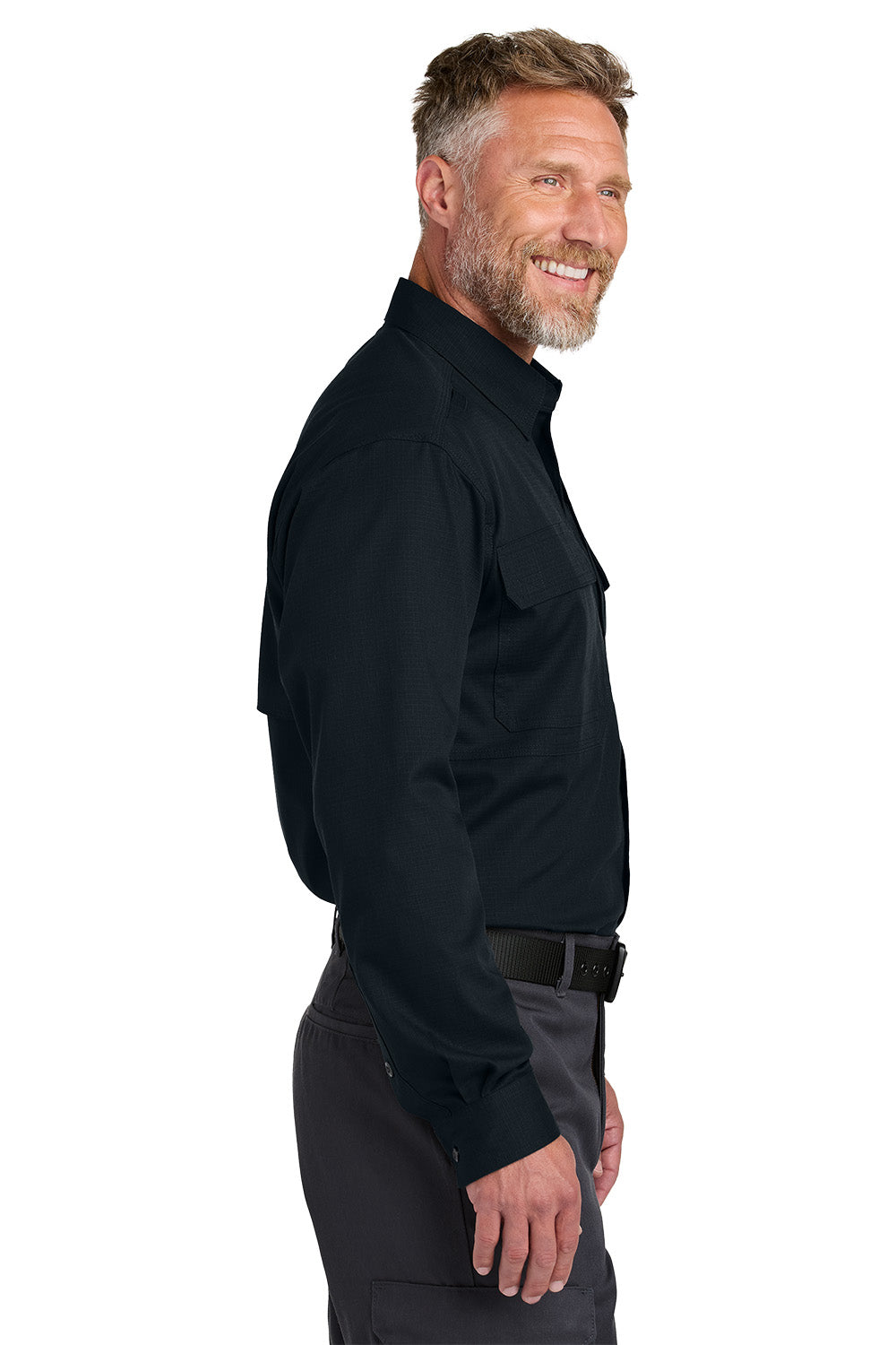 Man wearing a black shirt and gray pants on a white background embroidered CornerStone® Long Sleeve Select Tactical Shirt