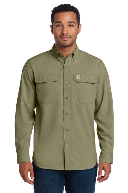 Man wearing a green Carhartt shirt on a white background embroidered Carhartt Force® Solid Long Sleeve Shirt