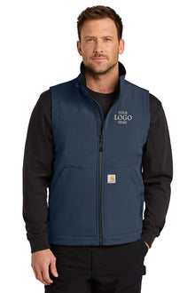 Man wearing a navy blue vest with space for a logo on a white background embroidered Carhartt® Rain Defender® Soft Shell Vest