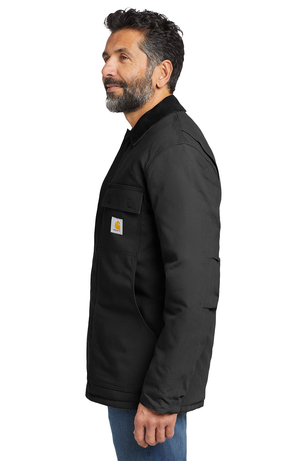 Man wearing a black jacket with a visible brand logo on a white background embroidered Carhartt® Duck Traditional Coat