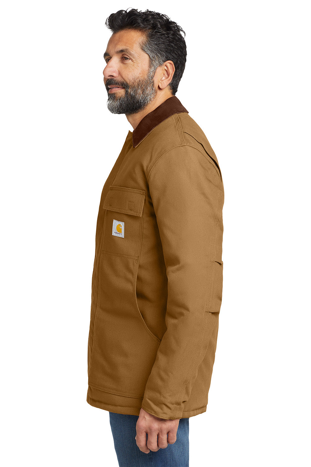 Man wearing a brown jacket with a visible brand logo on a white background embroidered Carhartt® Duck Traditional Coat