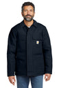 Man wearing a black jacket with a visible brand logo on a white background embroidered Carhartt® Duck Traditional Coat