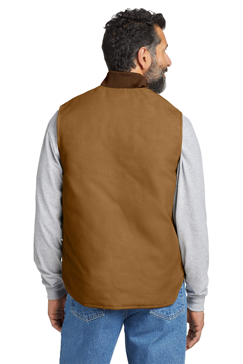 Man wearing a brown vest over a gray shirt with blue jeans on a white background embroidered Carhartt® Duck Vest