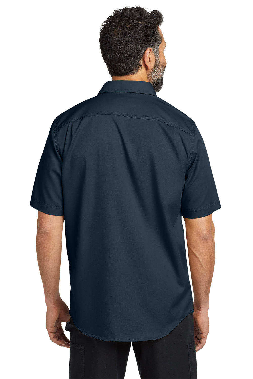 Man wearing a navy blue short-sleeve shirt on a white background embroidered Carhartt® Rugged Professional™ Series Short Sleeve Shirt