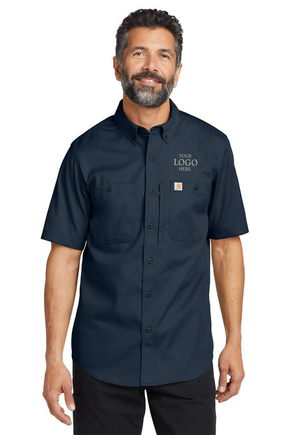 Man wearing a navy blue short-sleeve work shirt with customizable logo area on a white background embroidered Carhartt® Rugged Professional™ Series Short Sleeve Shirt
