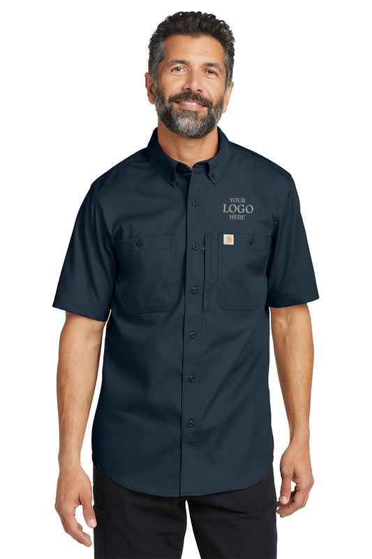 Man wearing a navy blue short-sleeve work shirt with customizable logo area on a white background embroidered Carhartt® Rugged Professional™ Series Short Sleeve Shirt