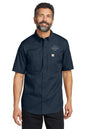 Man wearing a navy blue short-sleeve work shirt with customizable logo area on a white background embroidered Carhartt® Rugged Professional™ Series Short Sleeve Shirt
