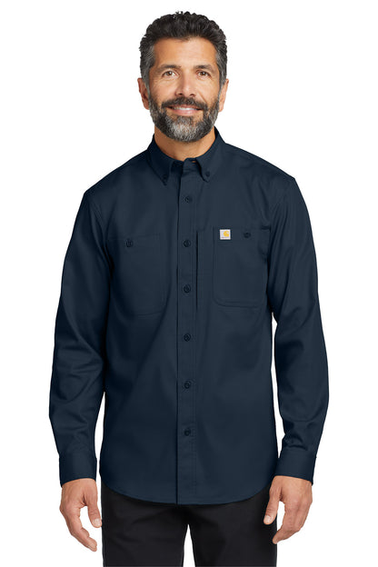 Man wearing a navy long-sleeve shirt with a Carhartt logo on a white background embroidered Carhartt® Rugged Professional™ Series Long Sleeve Shirt