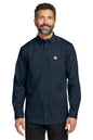 Man wearing a navy long-sleeve shirt with a Carhartt logo on a white background embroidered Carhartt® Rugged Professional™ Series Long Sleeve Shirt