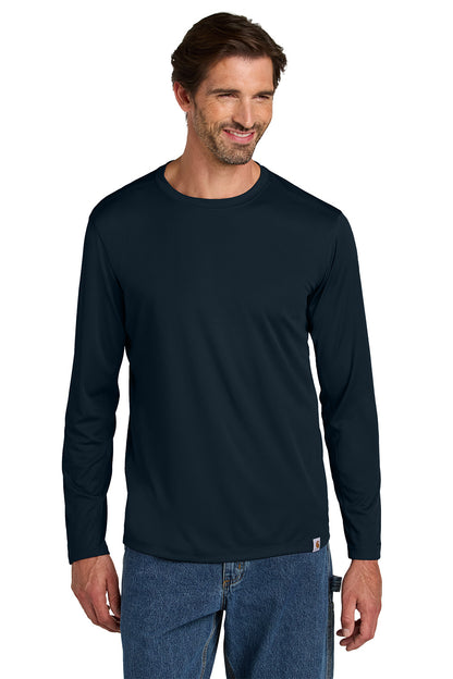 Man wearing a navy long-sleeve shirt and blue jeans on a white background embroidered Carhartt Force® Sun Defender™ Long Sleeve Shirt