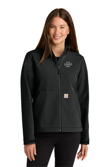Woman wearing a black jacket with a logo on a white background Carhartt® Women’s Rain Defender® Soft Shell Jacket, Embroidered