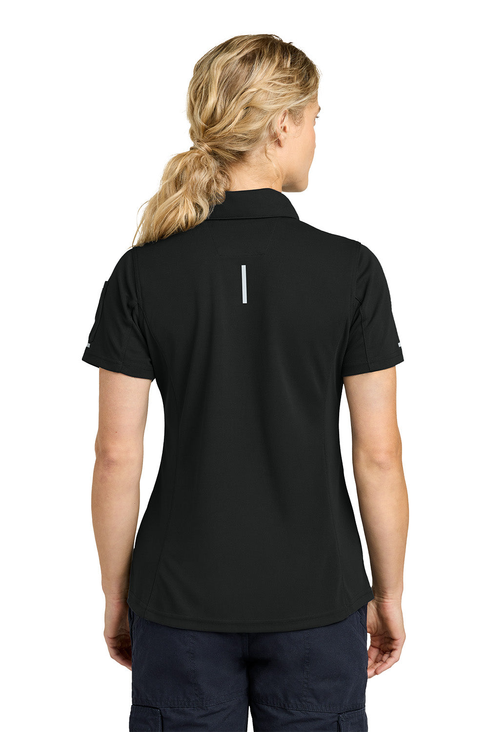 Person wearing a black polo shirt with a small white logo on the back, standing against a white background. Carhartt® Women’s FLD & RSCU Polo, Embroidered