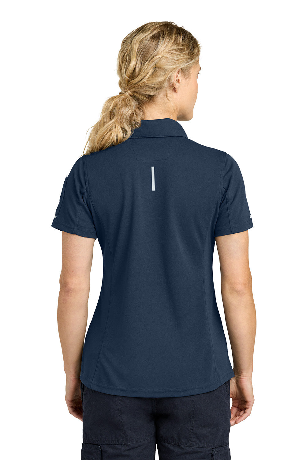 Person wearing a navy blue polo shirt with a small white logo on the back, on a white background. Carhartt® Women’s FLD & RSCU Polo, Embroidered