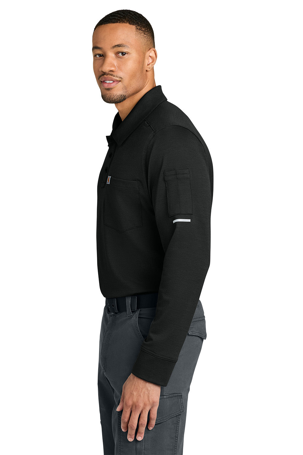 Man wearing a black long-sleeve shirt and gray pants on a white background, Carhartt® FLD & RSCU Long Sleeve Polo, Embroidered