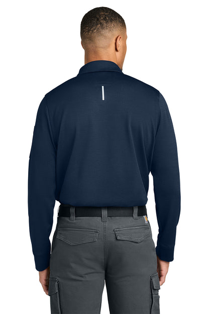 Person wearing a navy long-sleeve shirt and gray pants on a white background, Carhartt® FLD & RSCU Long Sleeve Polo, Embroidered