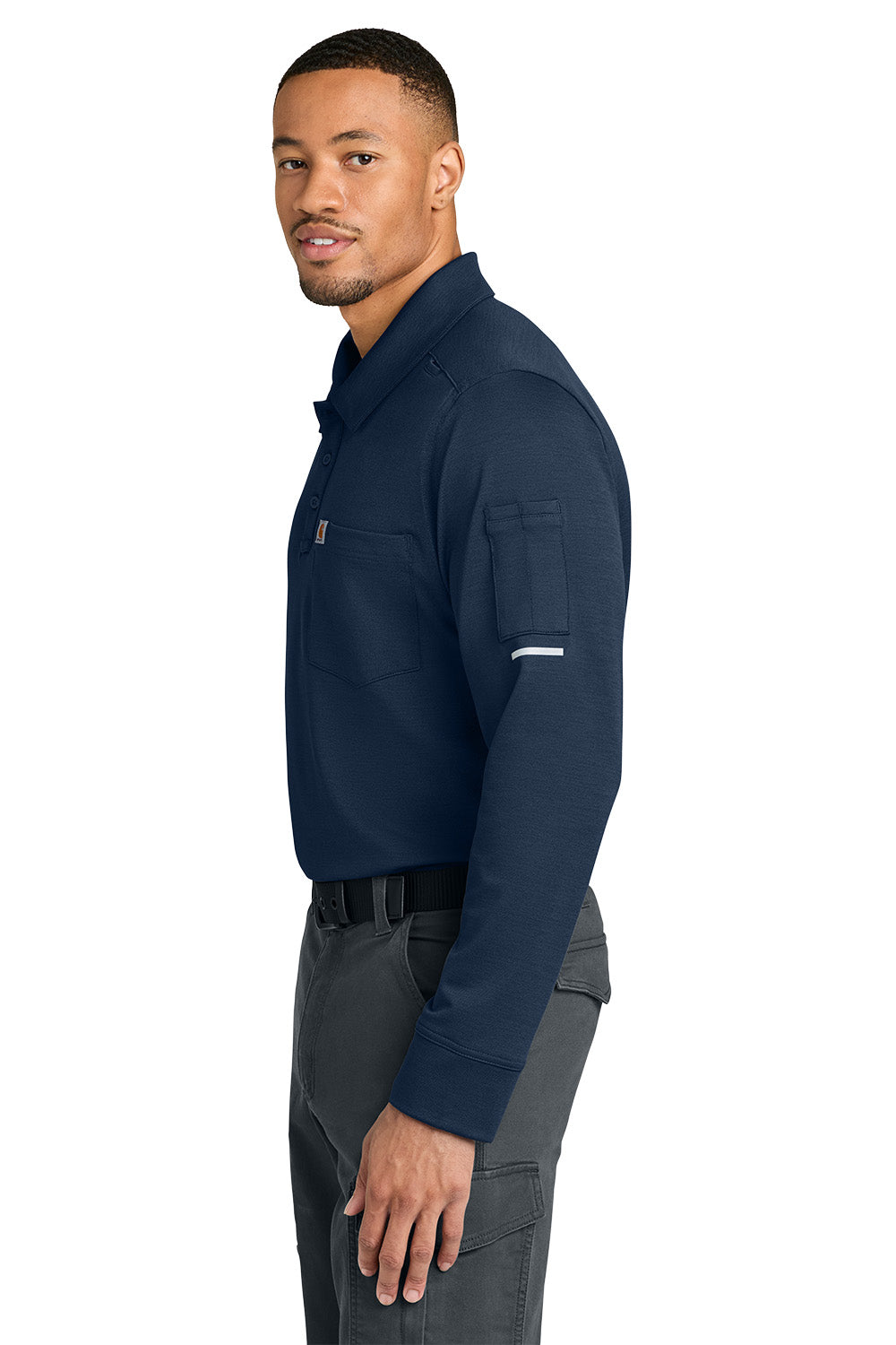 Man wearing a navy long-sleeve shirt and gray pants on a white background, Carhartt® FLD & RSCU Long Sleeve Polo, Embroidered