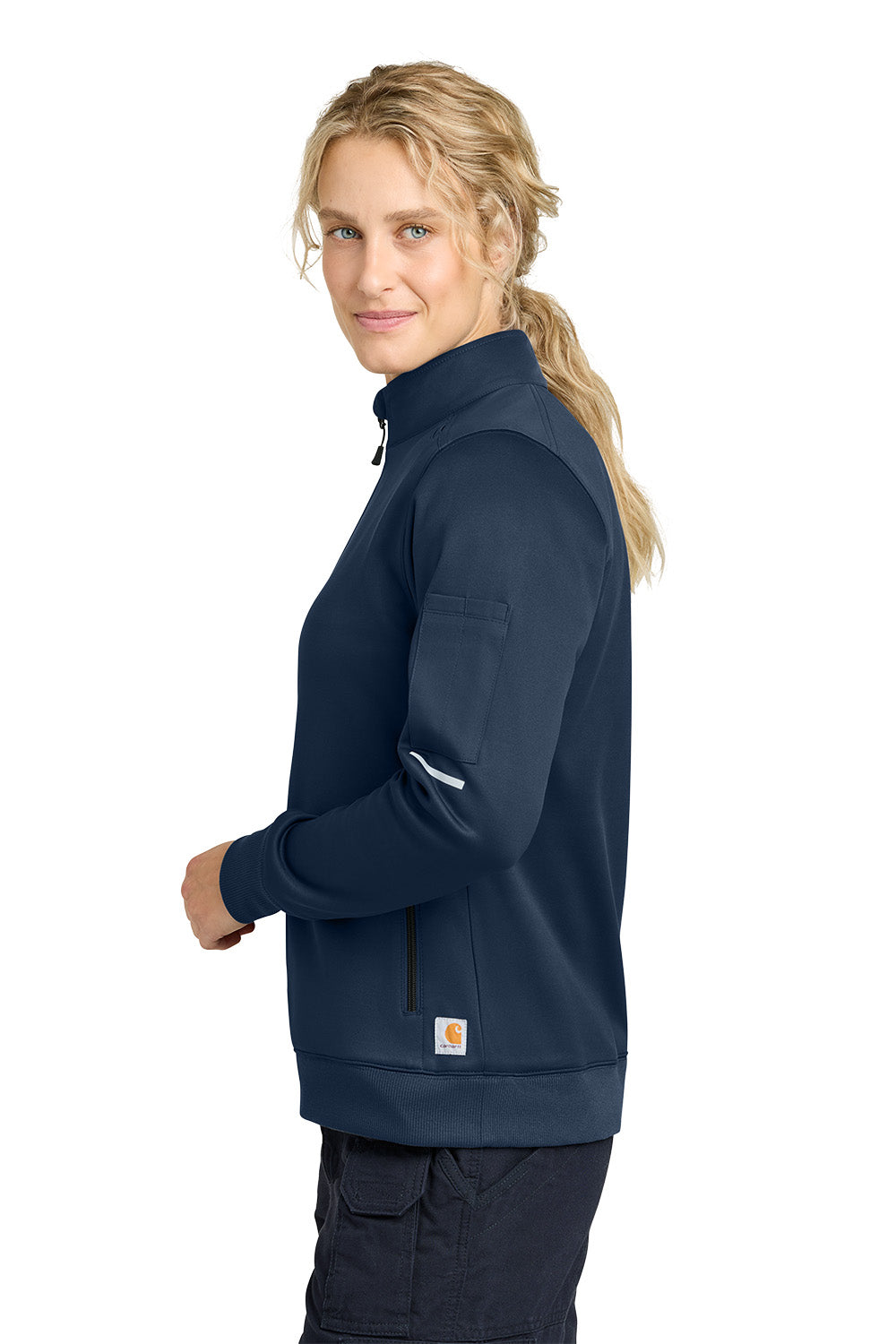 Woman wearing a navy blue jacket on a white background, Carhartt® Women’s FLD & RSCU 1/2-Zip Mid-Layer, Embroidered