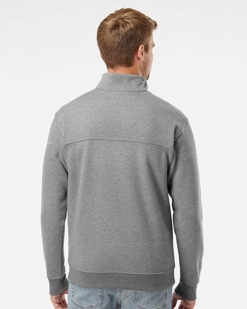Man wearing a gray half-zip sweater on a white background. Columbia Men's Hart Mountain™ II Half-Zip Pullover, Embroidered by Helmsman Stitch Co.