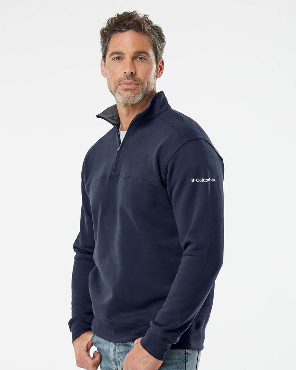 Man wearing a navy blue Columbia pullover on a white background. Columbia Men's Hart Mountain™ II Half-Zip Pullover, Embroidered by Helmsman Stitch Co.