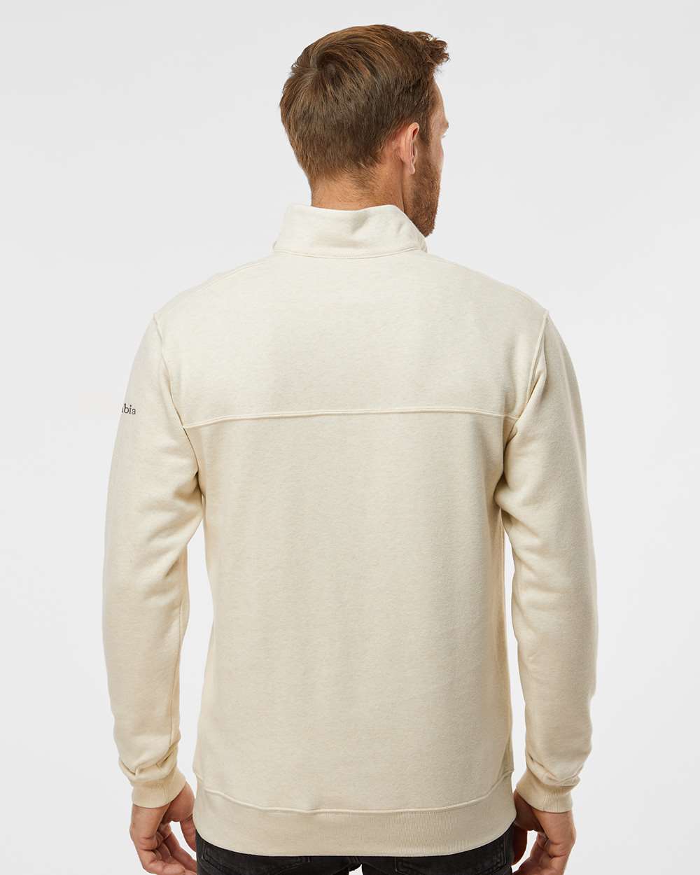 Man wearing a cream-colored fleece jacket on a white background. Columbia Men's Hart Mountain™ II Half-Zip Pullover, Embroidered by Helmsman Stitch Co.