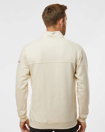 Man wearing a cream-colored fleece jacket on a white background. Columbia Men's Hart Mountain™ II Half-Zip Pullover, Embroidered by Helmsman Stitch Co.