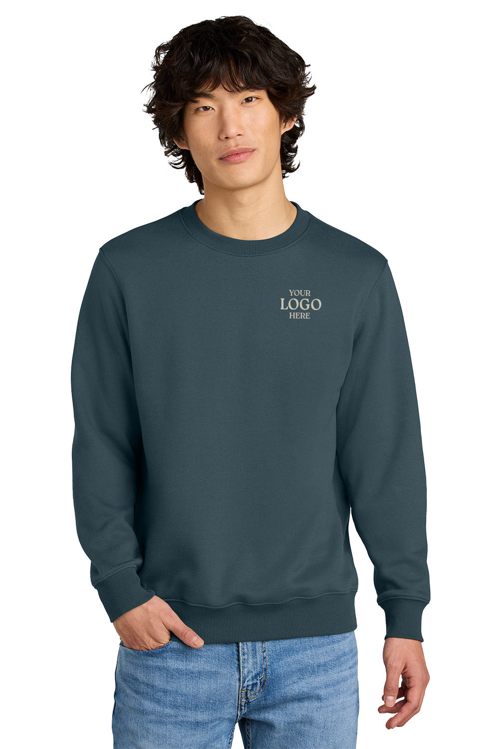 Person wearing a dark blue sweatshirt with 'PLACE LOGO HERE' text on a white background, Embroidered District® Perfect Weight® Fleece Crew
