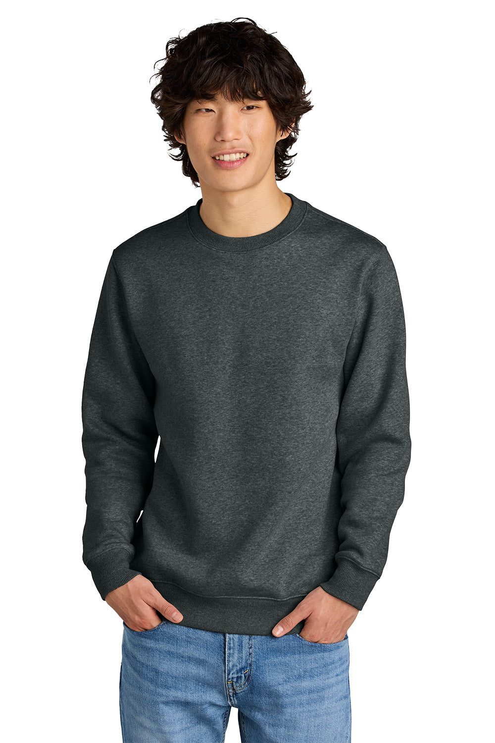 Man wearing a dark gray sweatshirt and blue jeans on a white background, Embroidered District® Perfect Weight® Fleece Crew