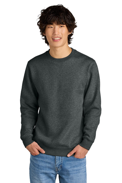 Man wearing a dark gray sweatshirt and blue jeans on a white background, Embroidered District® Perfect Weight® Fleece Crew