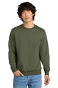Man wearing an olive green sweatshirt and blue jeans on a white background, Embroidered District® Perfect Weight® Fleece Crew