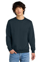 Person wearing a navy blue sweatshirt and light blue jeans on a white background, Embroidered District® Perfect Weight® Fleece Crew