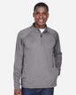 Man wearing a gray pullover with a quarter zip on a white background. Devon & Jones Men's Stretch Tech-Shell® Compass Quarter-Zip Pullover, Embroidered by Helmsman Stitch Co.