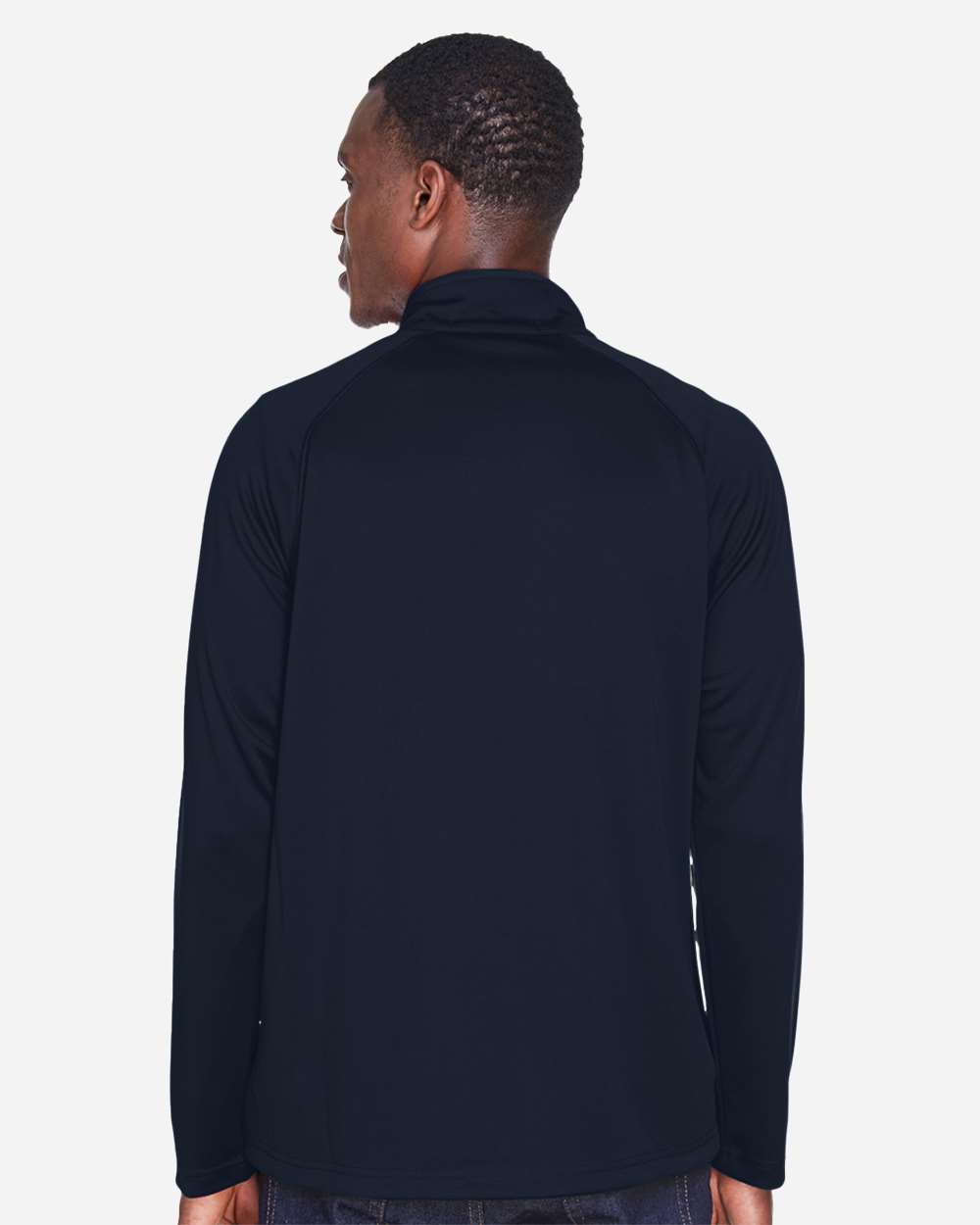 Person wearing a navy blue long-sleeve shirt on a white background. Devon & Jones Men's Stretch Tech-Shell® Compass Quarter-Zip Pullover, Embroidered by Helmsman Stitch Co.