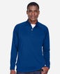 Man wearing a blue long-sleeve shirt with a white collar on a light gray background. Devon & Jones Men's Stretch Tech-Shell® Compass Quarter-Zip Pullover, Embroidered by Helmsman Stitch Co.