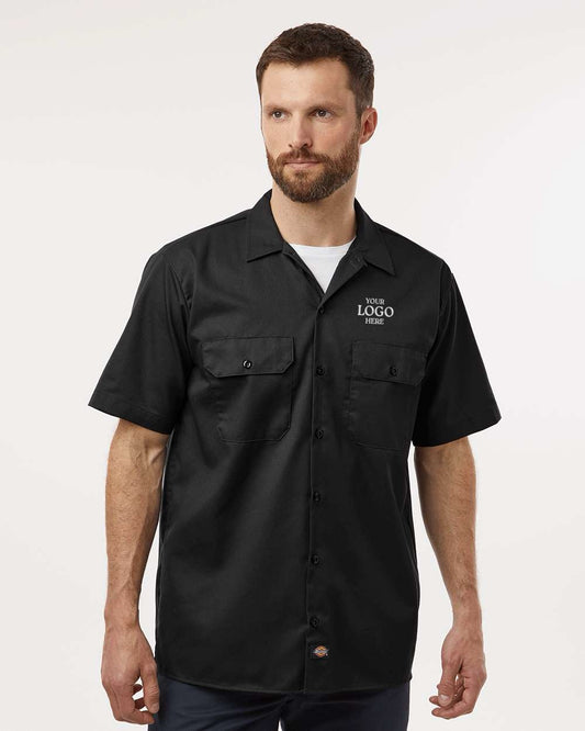 Man wearing a black short-sleeve shirt on a white background. Dickie's Men's Shirt Sleeve Work Shirt, Embroidered by Helmsman Stitch Co.