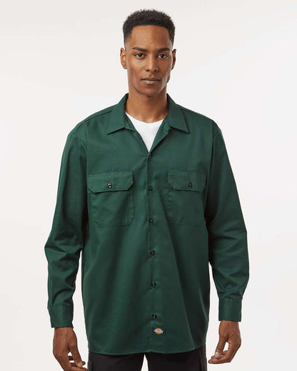 Man wearing a green shirt with a white background. Dickie's Men's Long Sleeve Work Shirt, Embroidered by Helmsman Stitch Co.