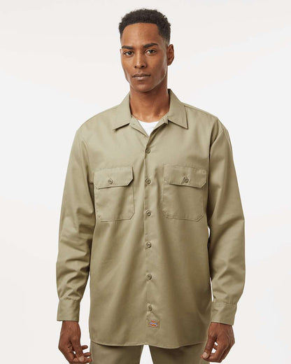 Man wearing a beige button-up shirt on a white background. Dickie's Men's Long Sleeve Work Shirt, Embroidered by Helmsman Stitch Co.
