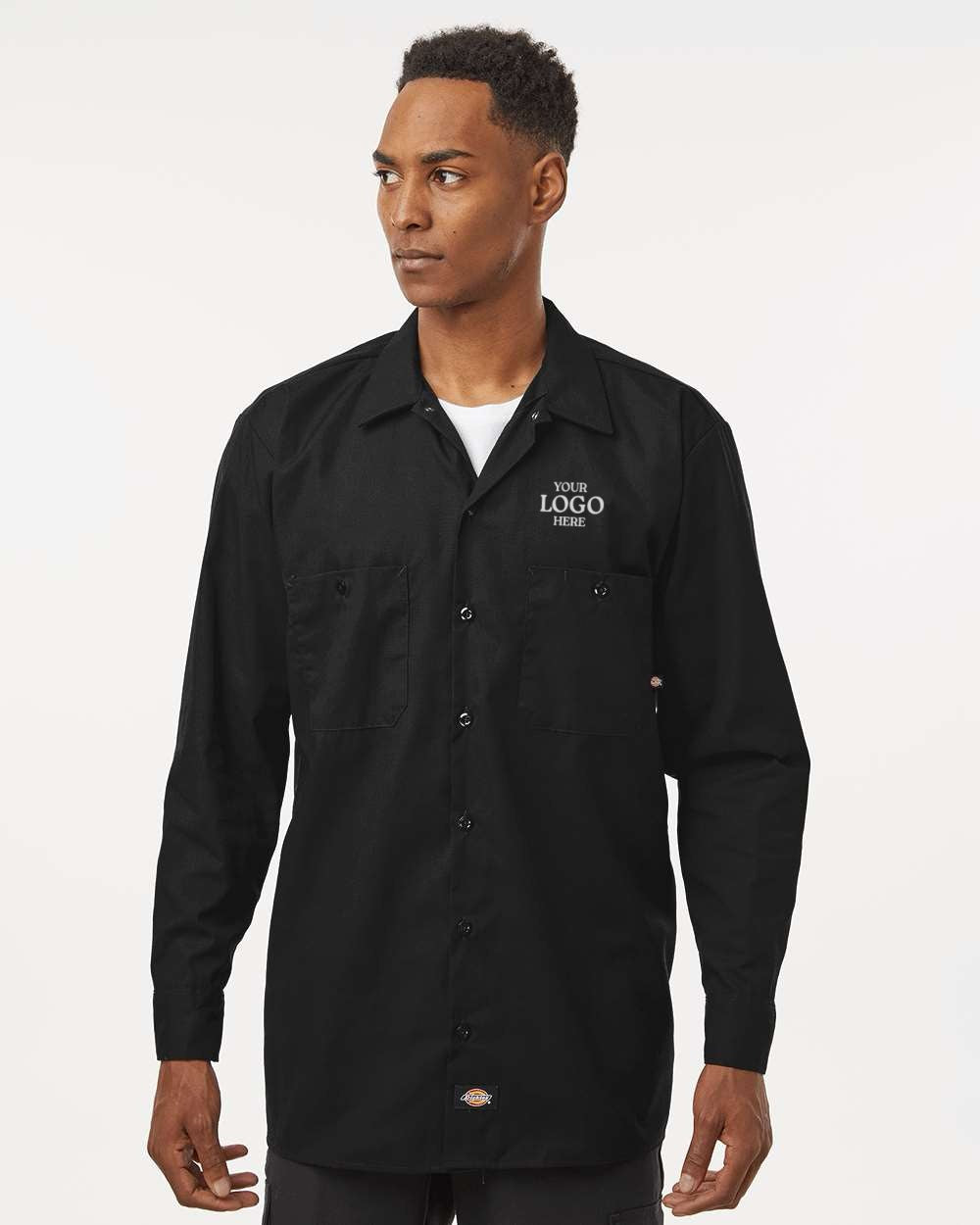 Man wearing a black shirt with a logo on a white background. Dickie's Men's Industrial long Sleeve Work Shirt, Embroidered by Helmsman Stitch Co.